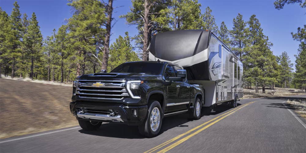 2025 Chevy Silverado 2500 HD towing a camper