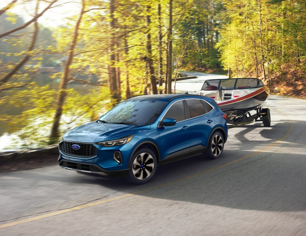 2025 Ford Escape Active towing a small boat
