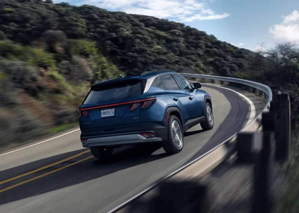 2025 Hyundai Tucson driving around a curve