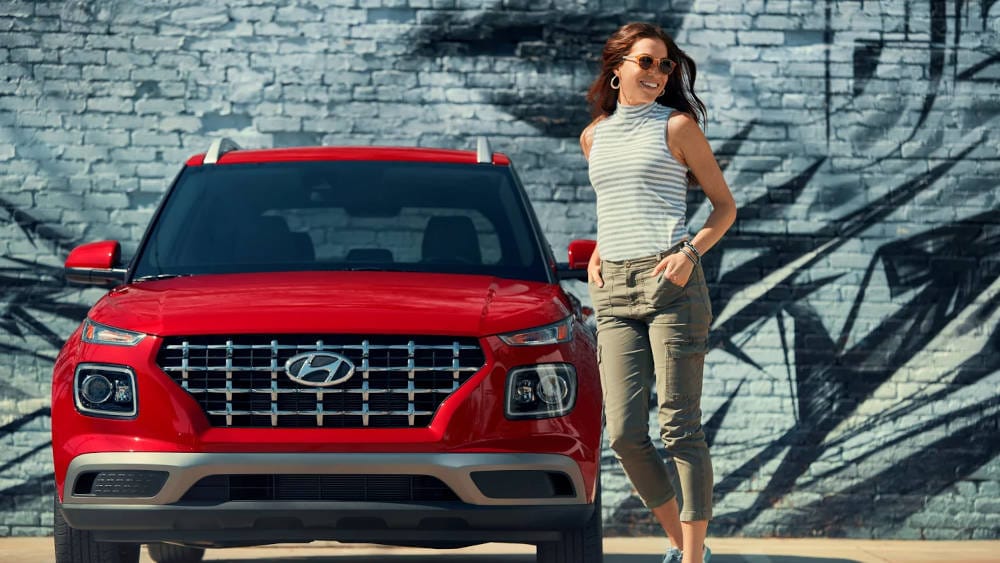 2024 Hyundai Venue SE with women standing next to it