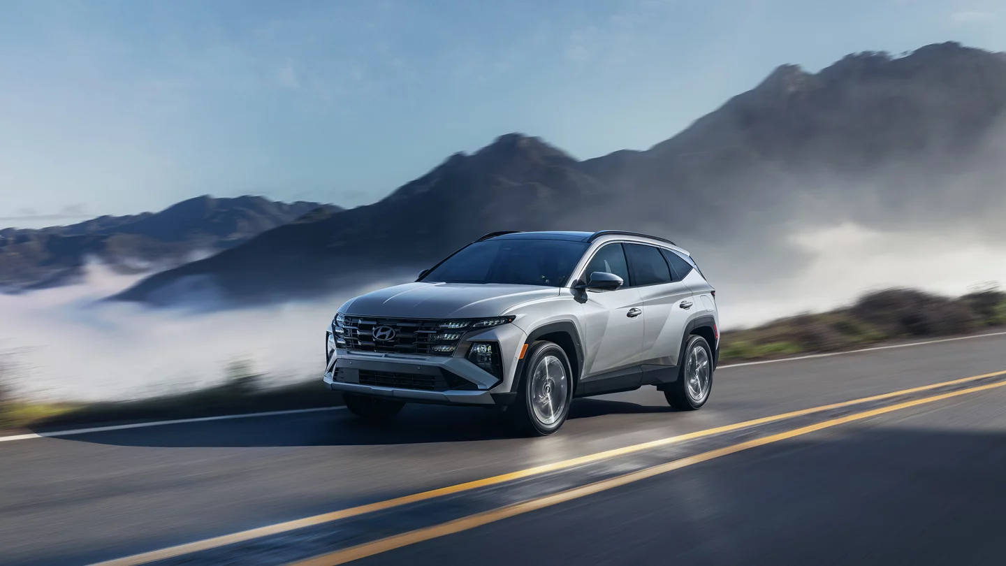 2025 Hyundai Tucson Plug-In Hybrid driving through the mountains