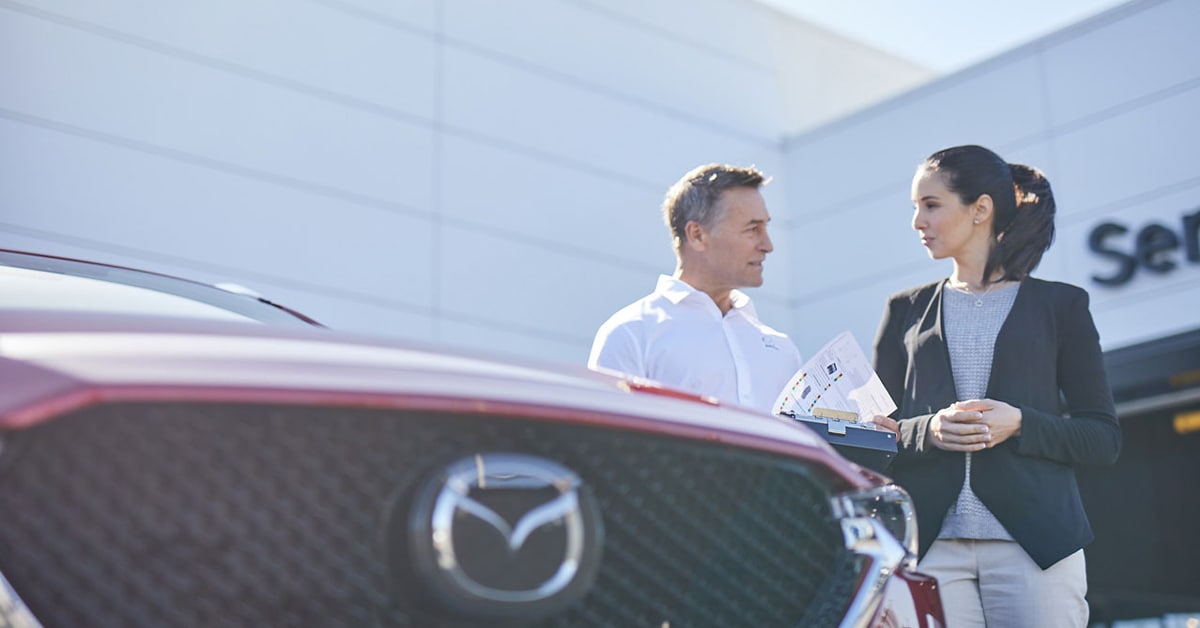 Customer with Mazda Service Tech.