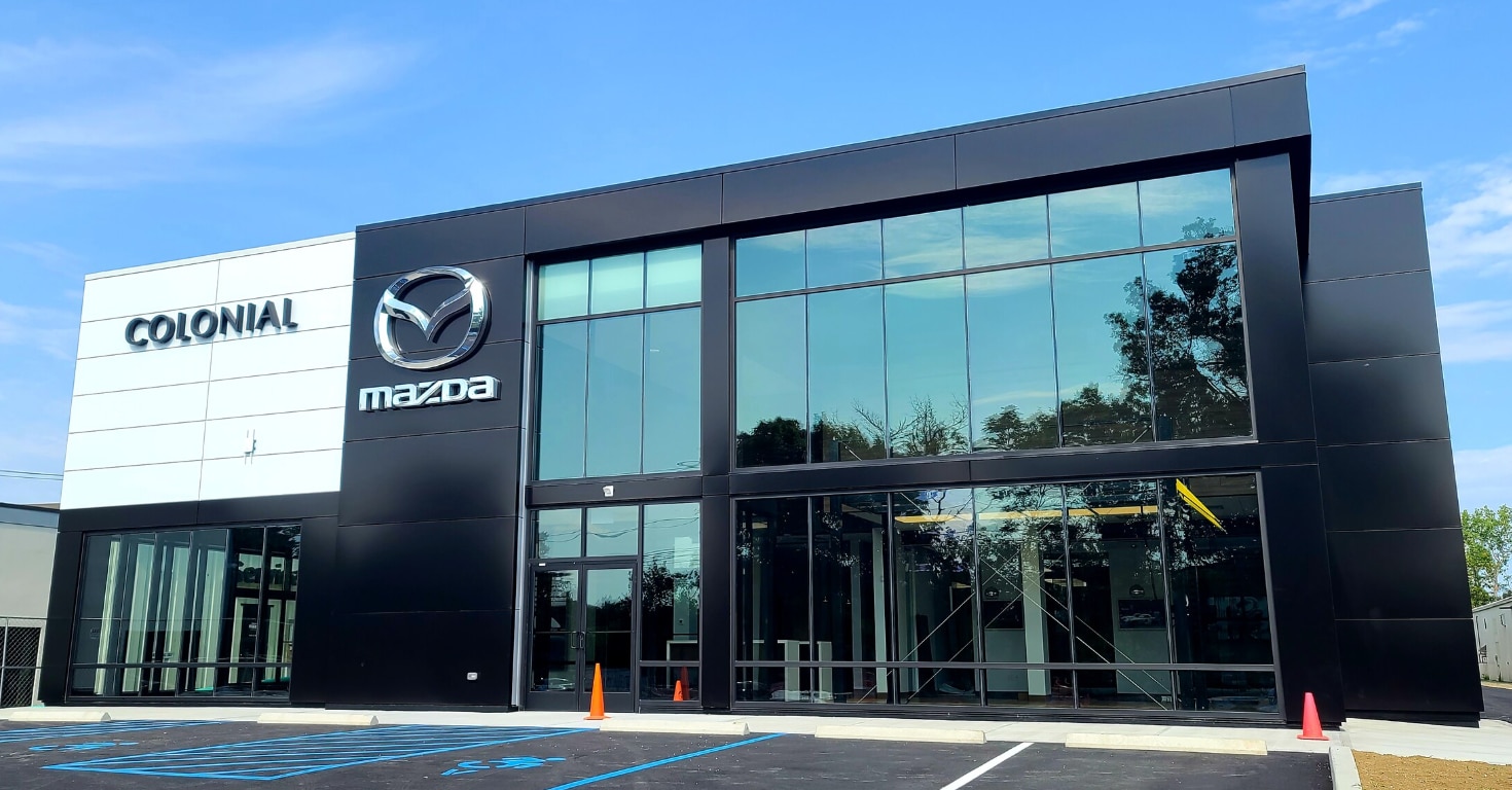 Colonial Mazda dealership storefront view.