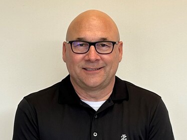 Staff member Chris Novotny from ID_2af06ba54b7a