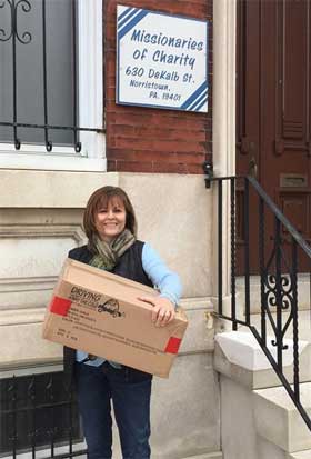 Donna Conicelli delivers winter coats for school kids at Norristown's Missionaries of Charity.