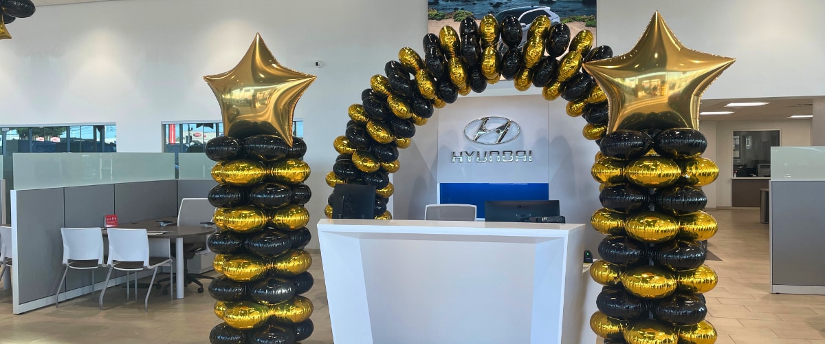 Elegant Front Desk Surrounded by Balloons