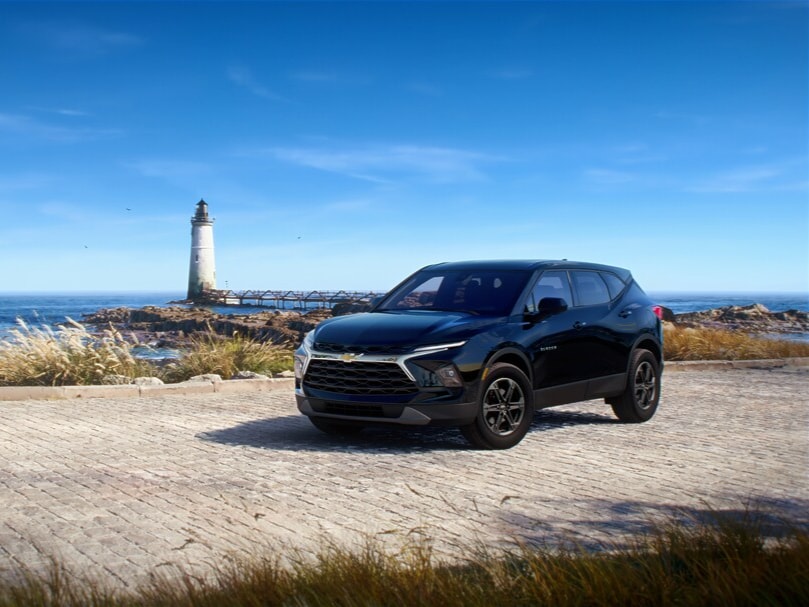 Chevrolet Blazer on beach by lighthouse