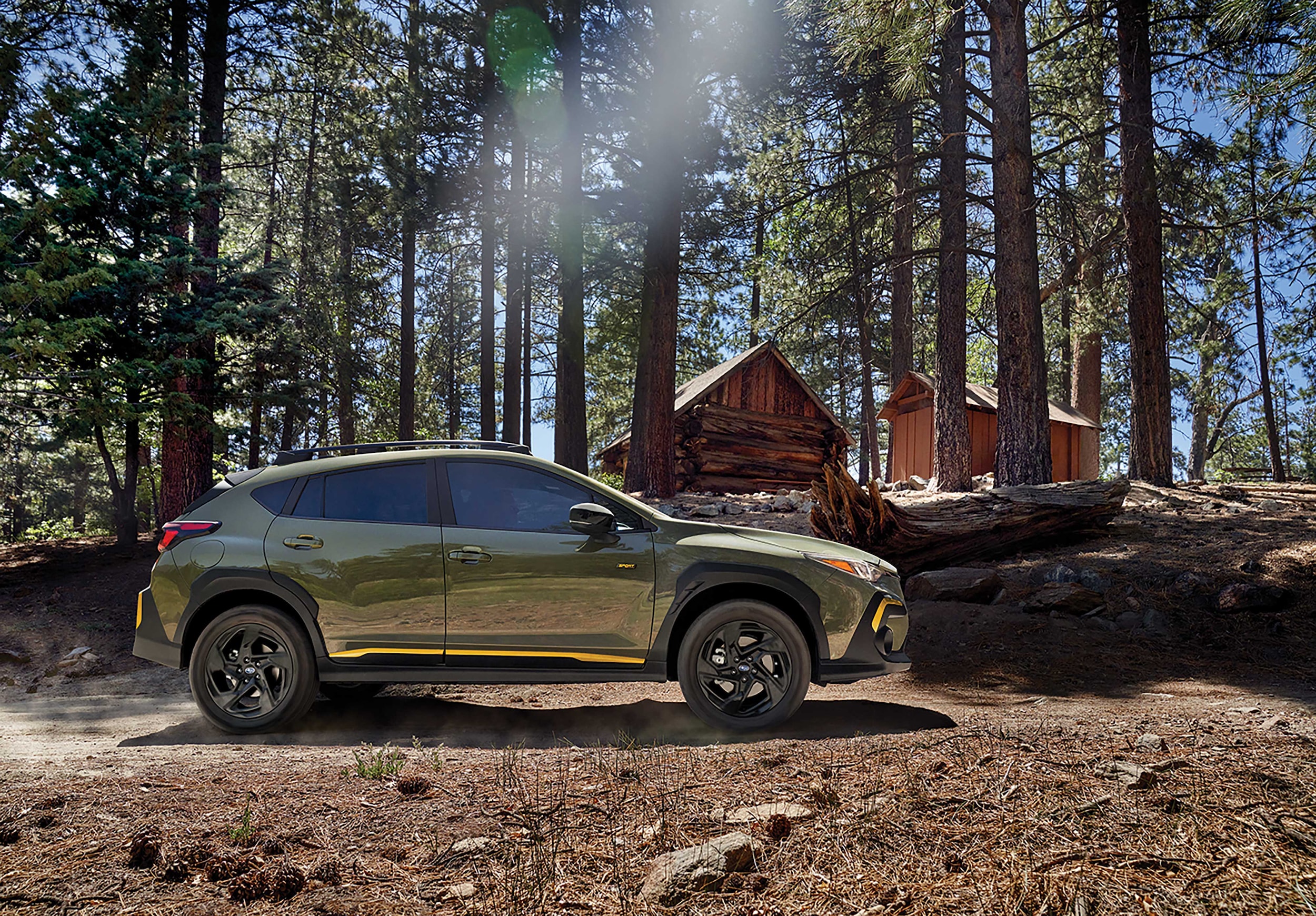 Subaru Crosstrek on trail in woods