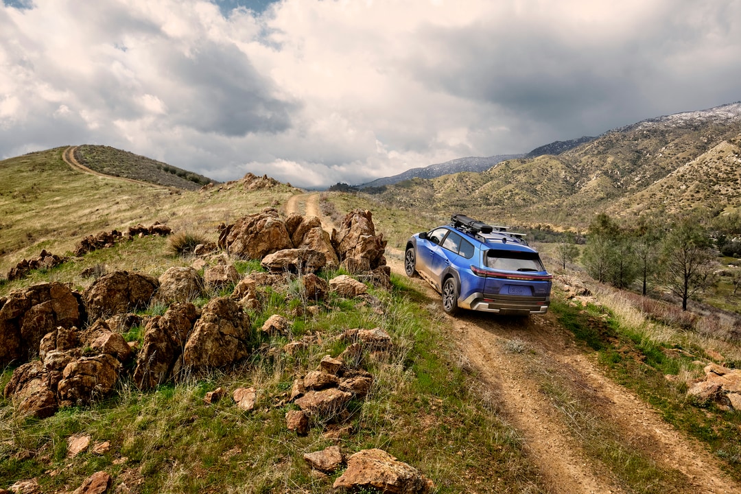 Subaru Trailseeker driving up dirt road