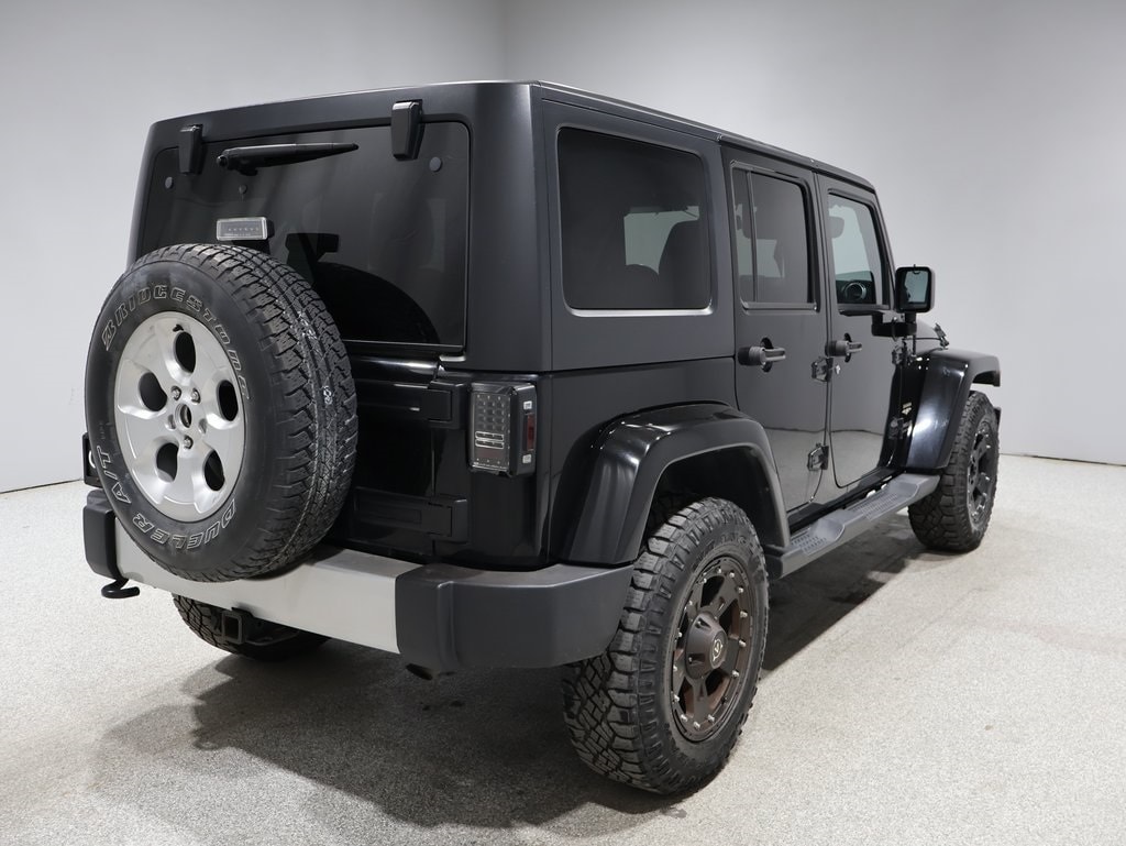Used 2015 Jeep Wrangler Unlimited Sahara with VIN 1C4BJWEG2FL502594 for sale in Fargo, ND