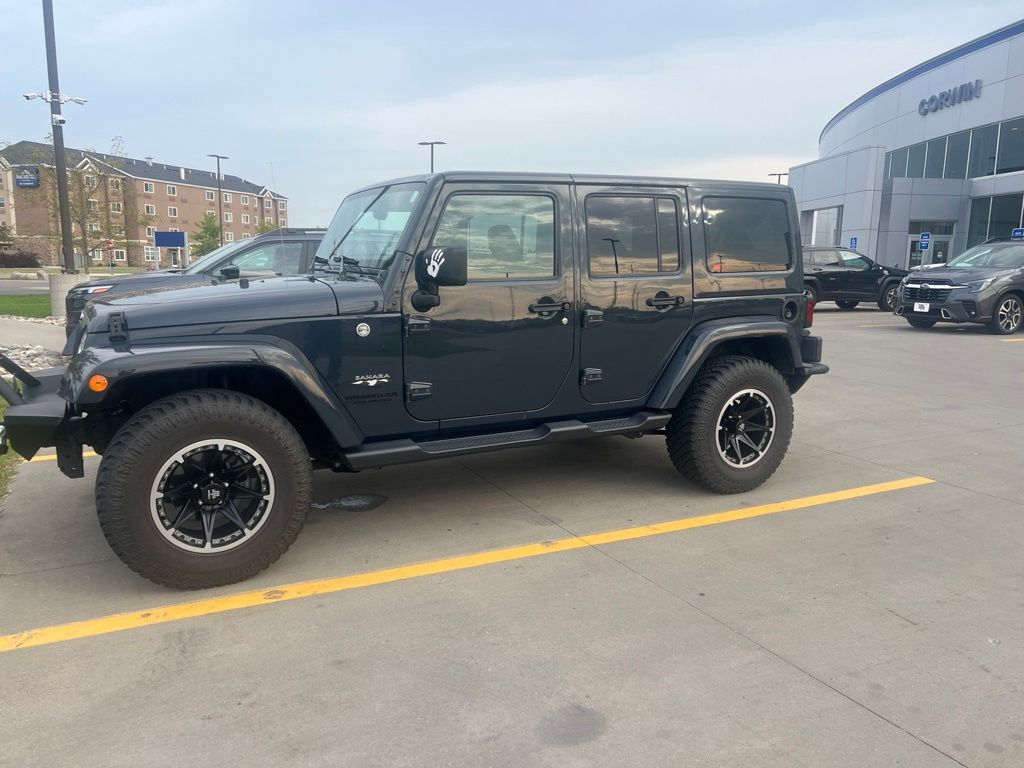 Used 2016 Jeep Wrangler Unlimited Sahara with VIN 1C4BJWEG9GL228019 for sale in Moorhead, Minnesota