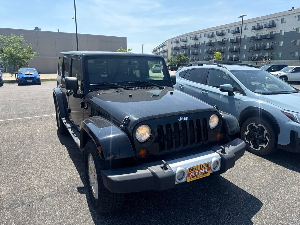 Used 2008 Jeep Wrangler Unlimited Sahara with VIN 1J4GA59138L585388 for sale in Moorhead, Minnesota
