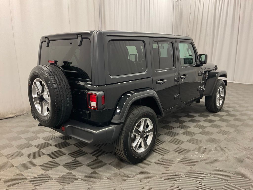 Used 2023 Jeep Wrangler 4-Door Sahara with VIN 1C4HJXEN7PW595501 for sale in Moorhead, Minnesota