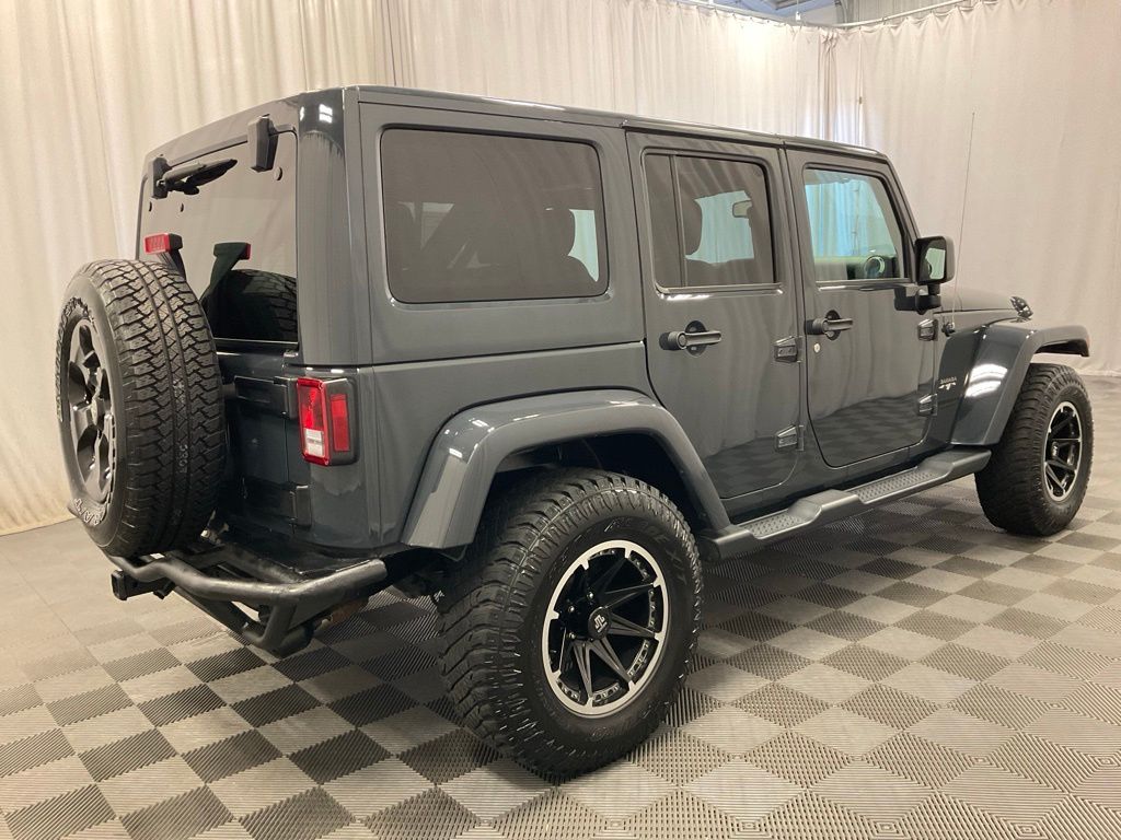 Used 2016 Jeep Wrangler Unlimited Sahara with VIN 1C4BJWEG9GL228019 for sale in Moorhead, Minnesota