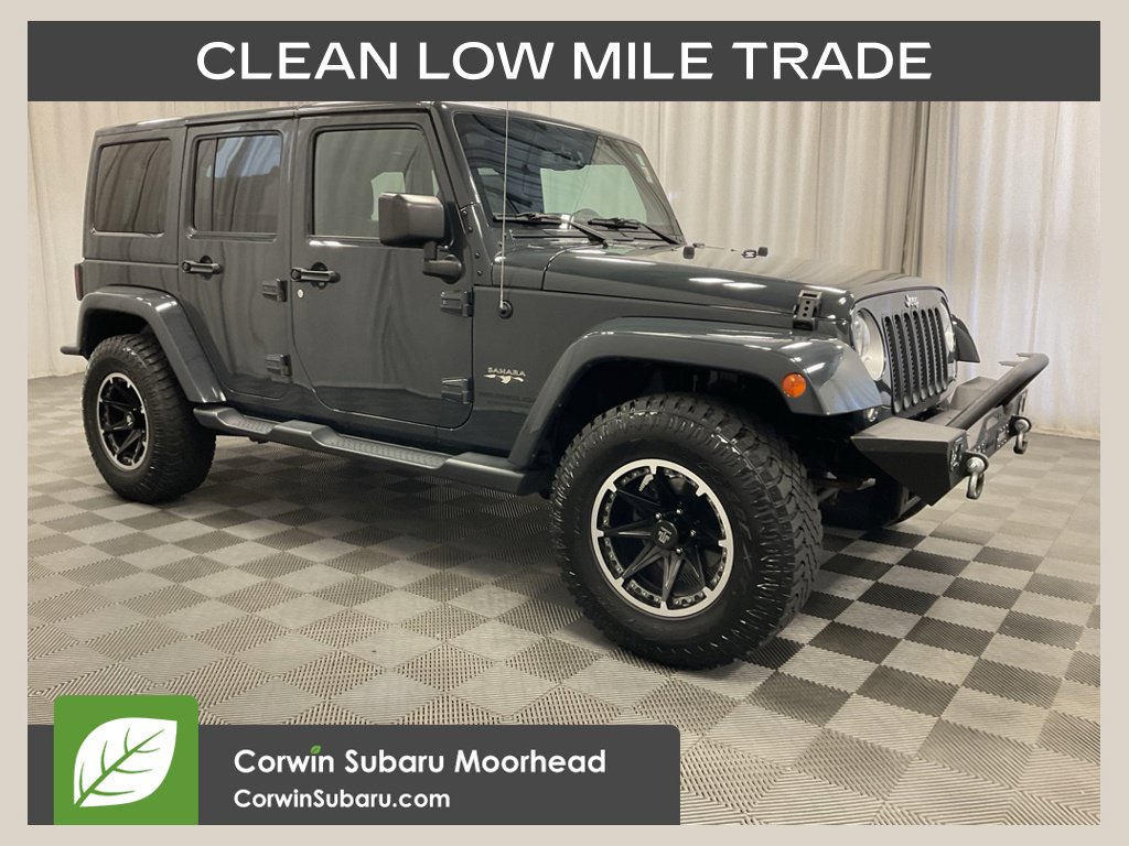 Used 2016 Jeep Wrangler Unlimited Sahara with VIN 1C4BJWEG9GL228019 for sale in Moorhead, Minnesota