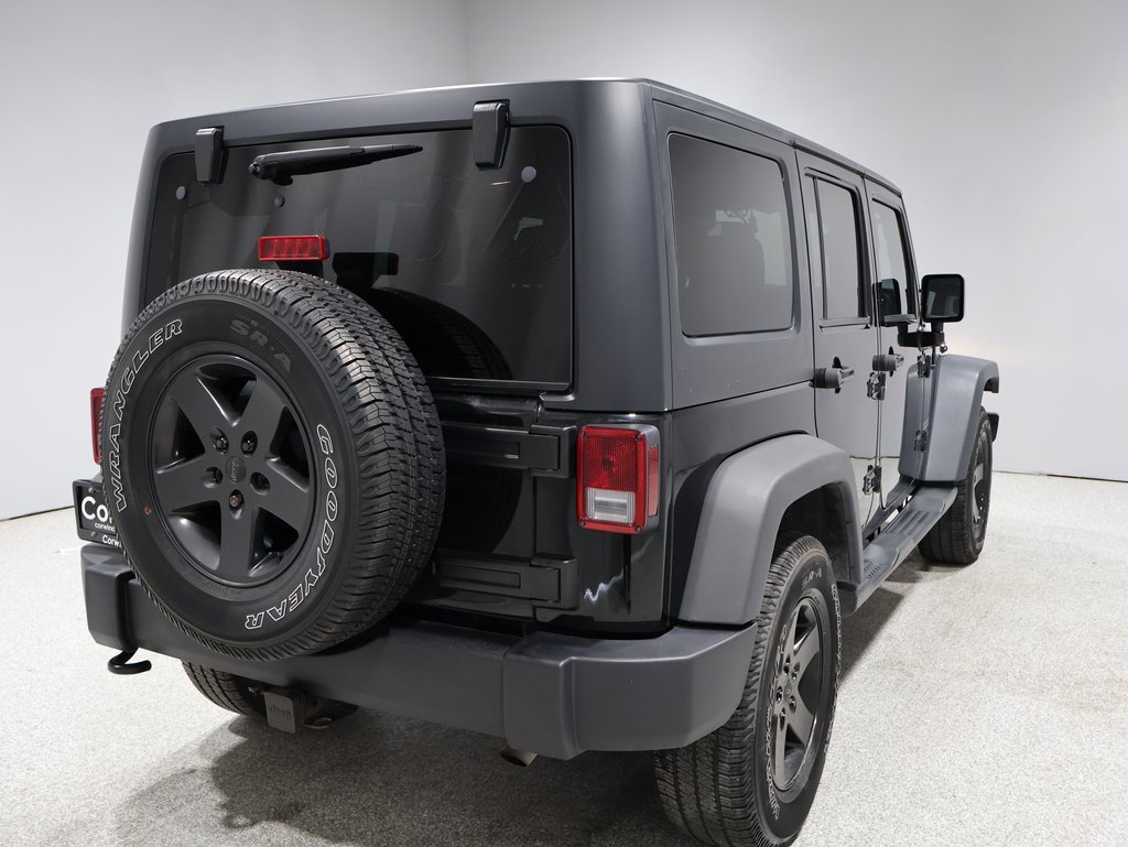 Used 2015 Jeep Wrangler Unlimited Sport with VIN 1C4BJWDG9FL570294 for sale in Fargo, ND