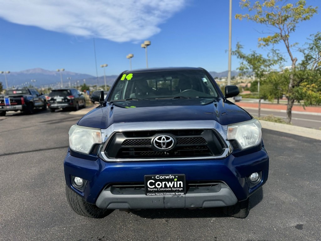 Used 2014 Toyota Tacoma Base with VIN 3TMLU4EN5EM147108 for sale in Colorado Springs, CO