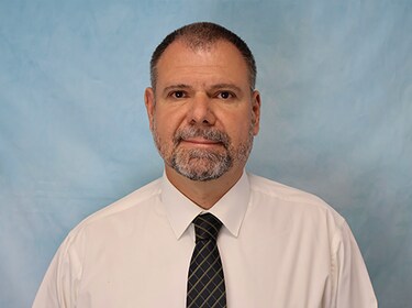 Staff member JOHN SKOKO from adf327ae9b1a