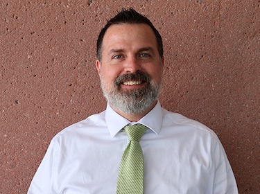 Staff member JUSTIN MITCHELL from 723a05f2501b