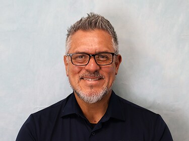 Staff member Ernesto Poston from adf327ae9b1a