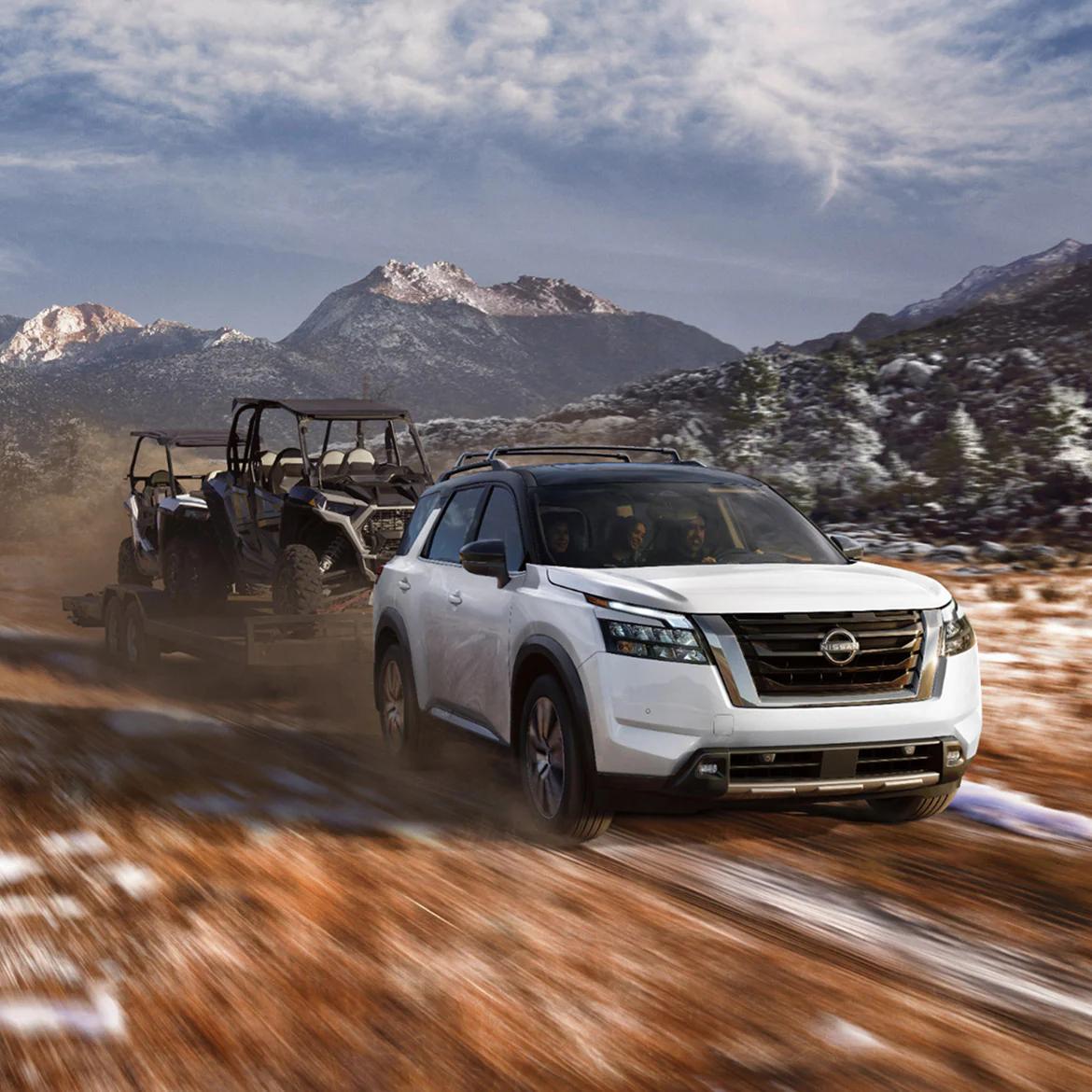 2025-nissan-pathfinder-towing-snowy-mountains.webp