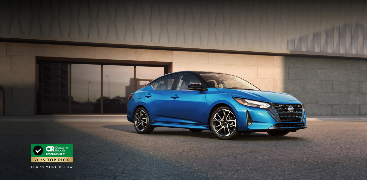 2025-nissan-sentra-blue-driveway-front-building-award.webp