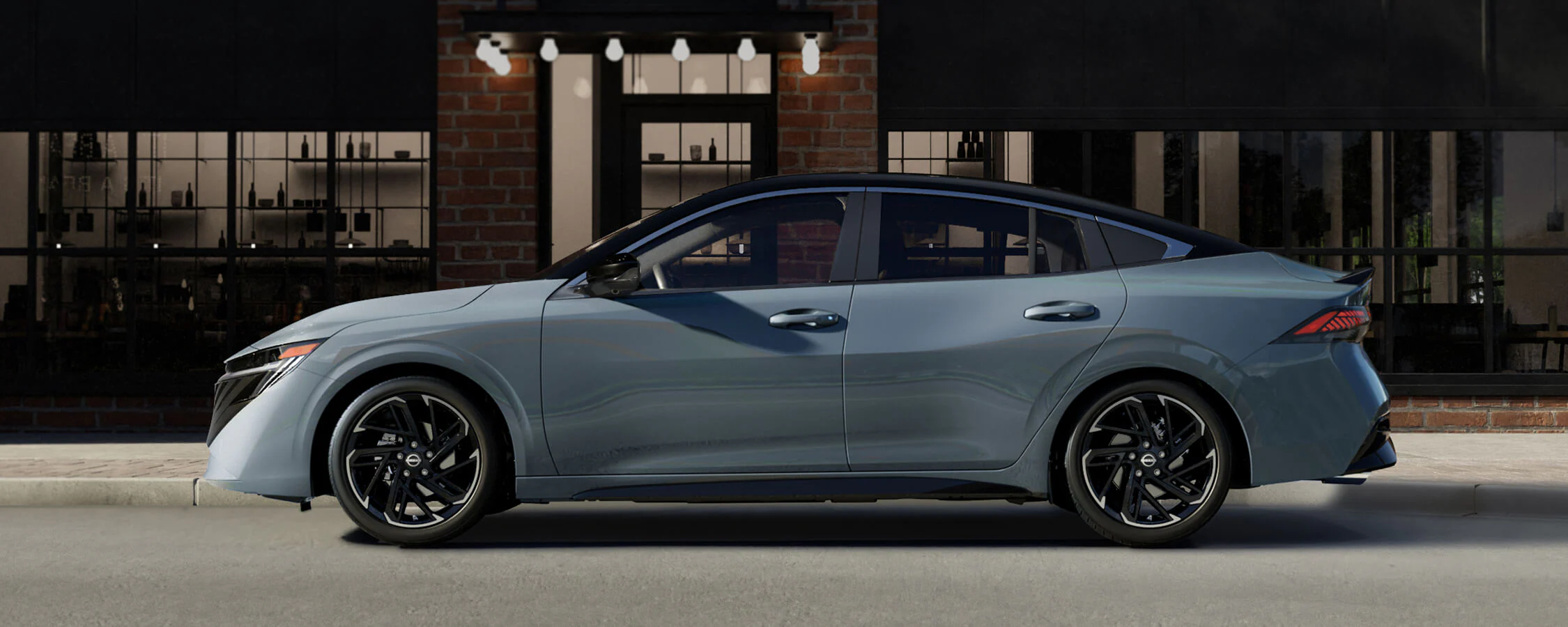 2026-nissan-sentra-side-view-parked-front-building-windows-subtle-lighting.webp