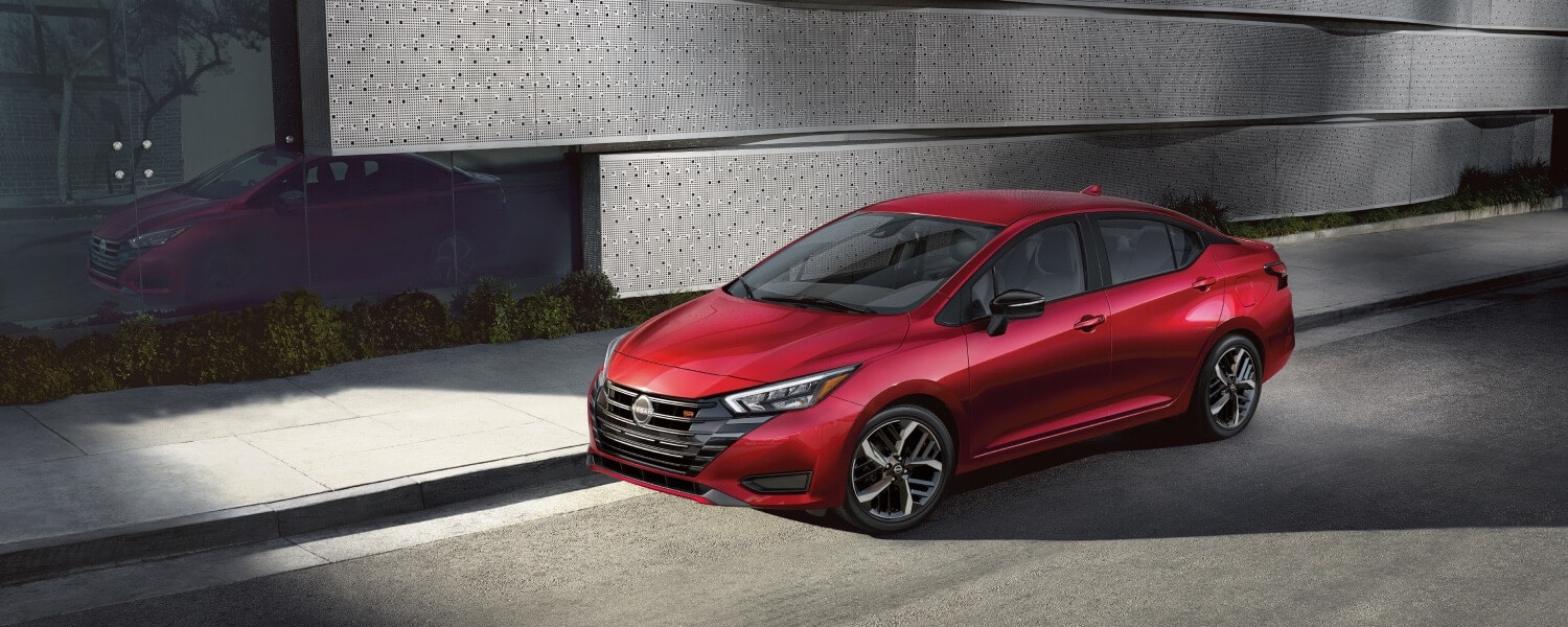 2025-nissan-versa-view-of-bold-front-end-parked-on-a-city-street.jpg