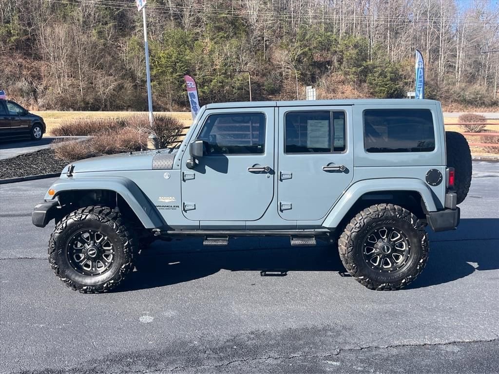 Used 2014 Jeep Wrangler Unlimited Sahara with VIN 1C4HJWEG7EL305381 for sale in Franklin, NC