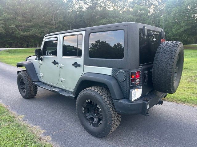 Used 2011 Jeep Wrangler Unlimited Sport with VIN 1J4BA3H12BL567083 for sale in Stonecrest, GA