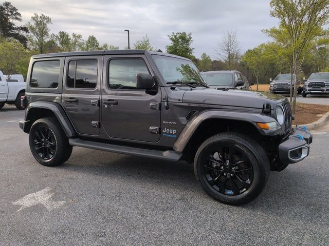 Used 2022 Jeep Wrangler Unlimited Sahara 4XE with VIN 1C4JJXP68NW276760 for sale in Stonecrest, GA