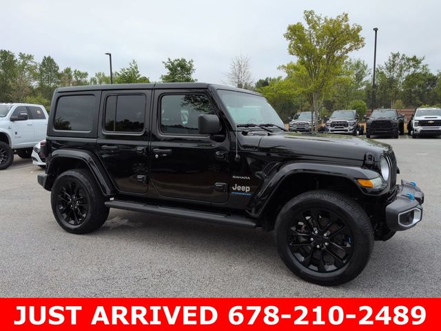 Used 2023 Jeep Wrangler 4xe Sahara 4XE with VIN 1C4JJXP60PW663614 for sale in Stonecrest, GA