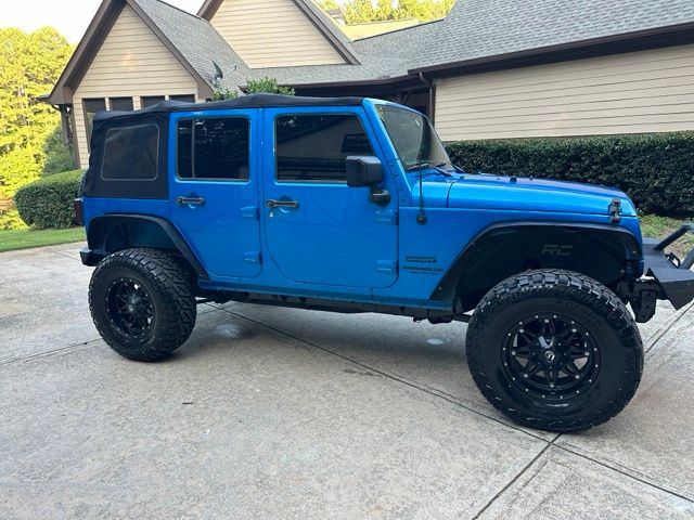 Used 2015 Jeep Wrangler Unlimited Sport with VIN 1C4BJWDG1FL509683 for sale in Stonecrest, GA