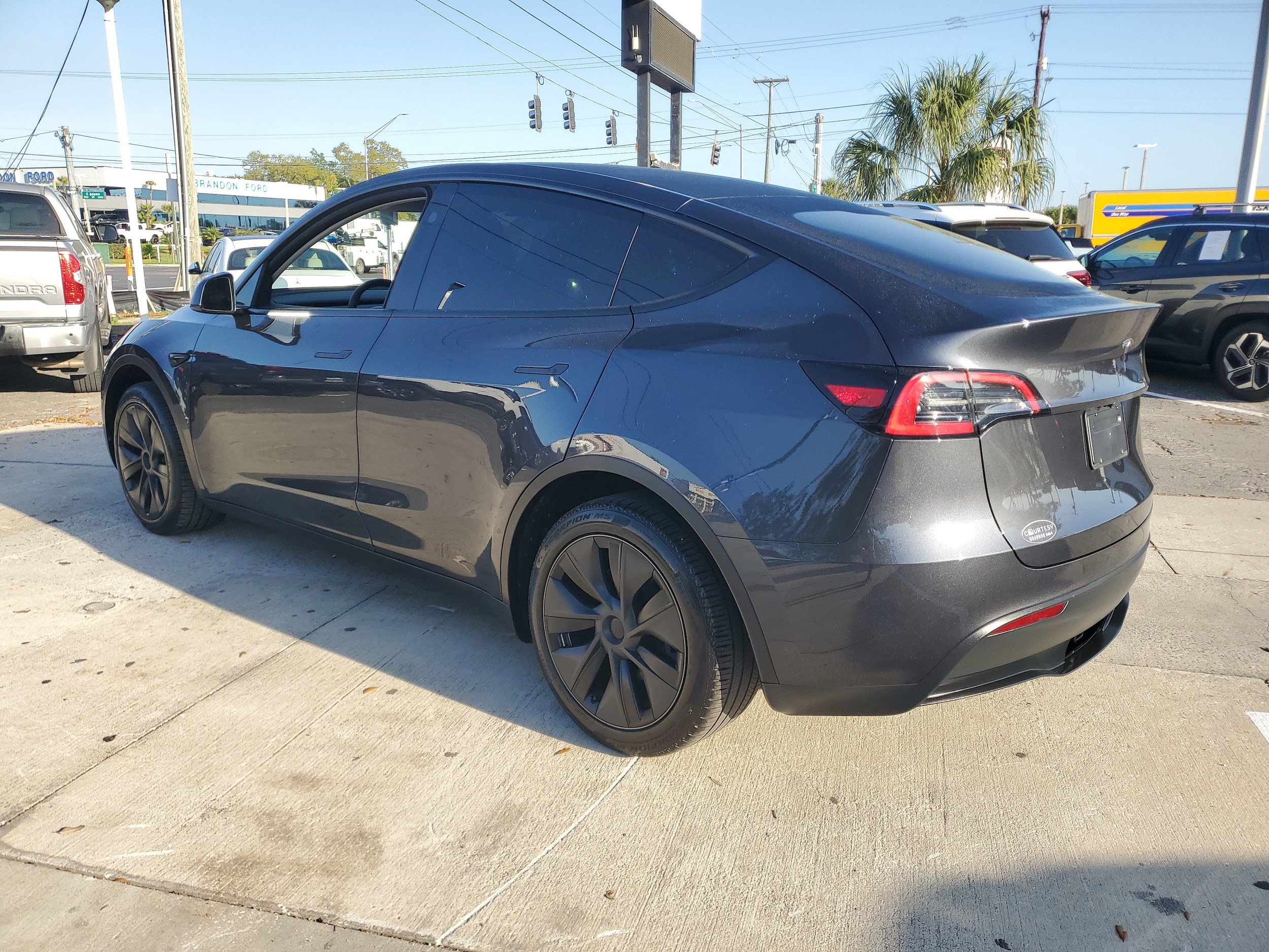 Used 2025 Tesla Model Y Long Range with VIN 7SAYGDED7SA350800 for sale in Tampa, FL