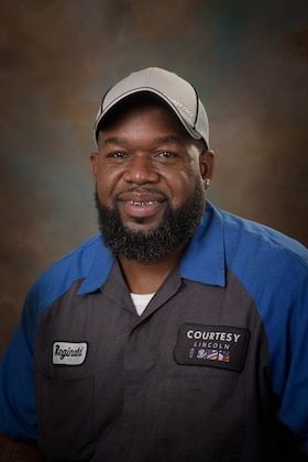 Staff member Reginald Sam from 01a6564b0d9c
