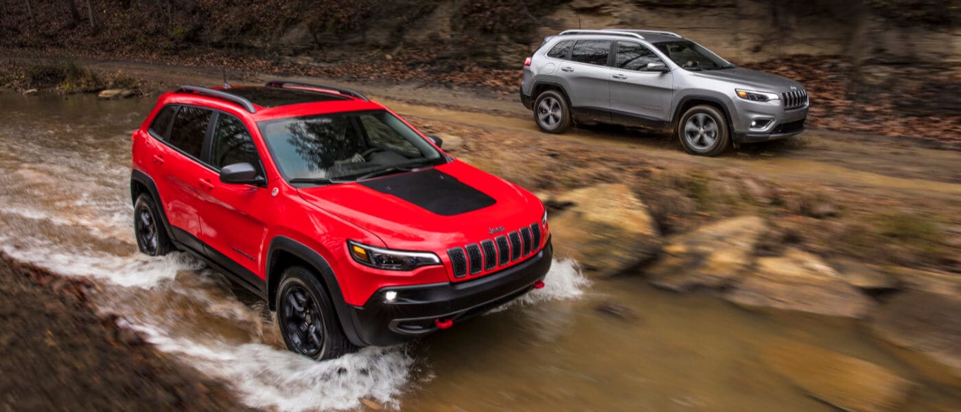 2020 Jeep Cherokee exterior two Cherokee's in woods by stream