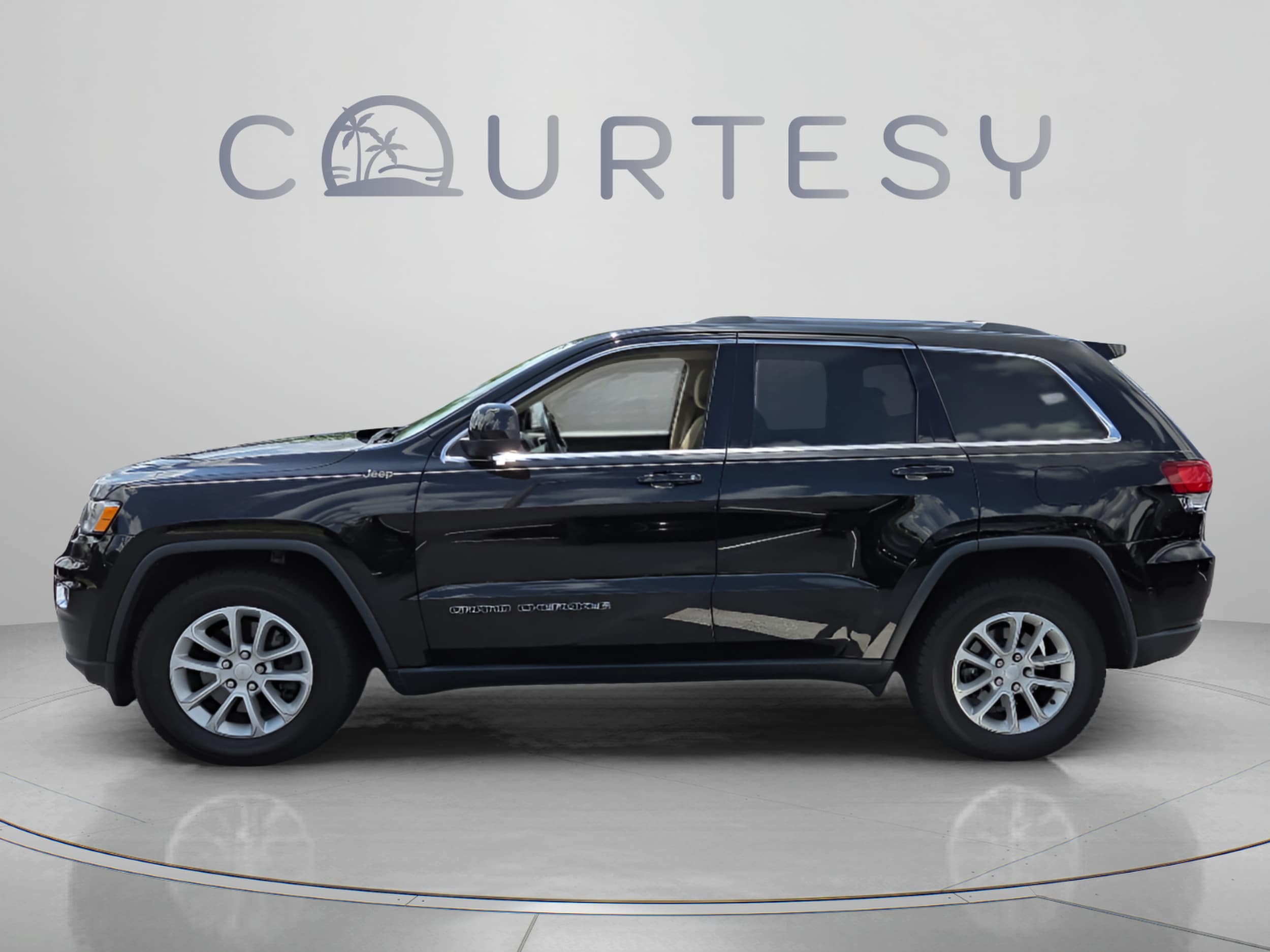 Used 2021 Jeep Grand Cherokee Laredo E with VIN 1C4RJEAG7MC624833 for sale in Palm Harbor, FL