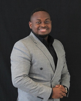 Staff member Roody Jean from ID_4e00f98019f4