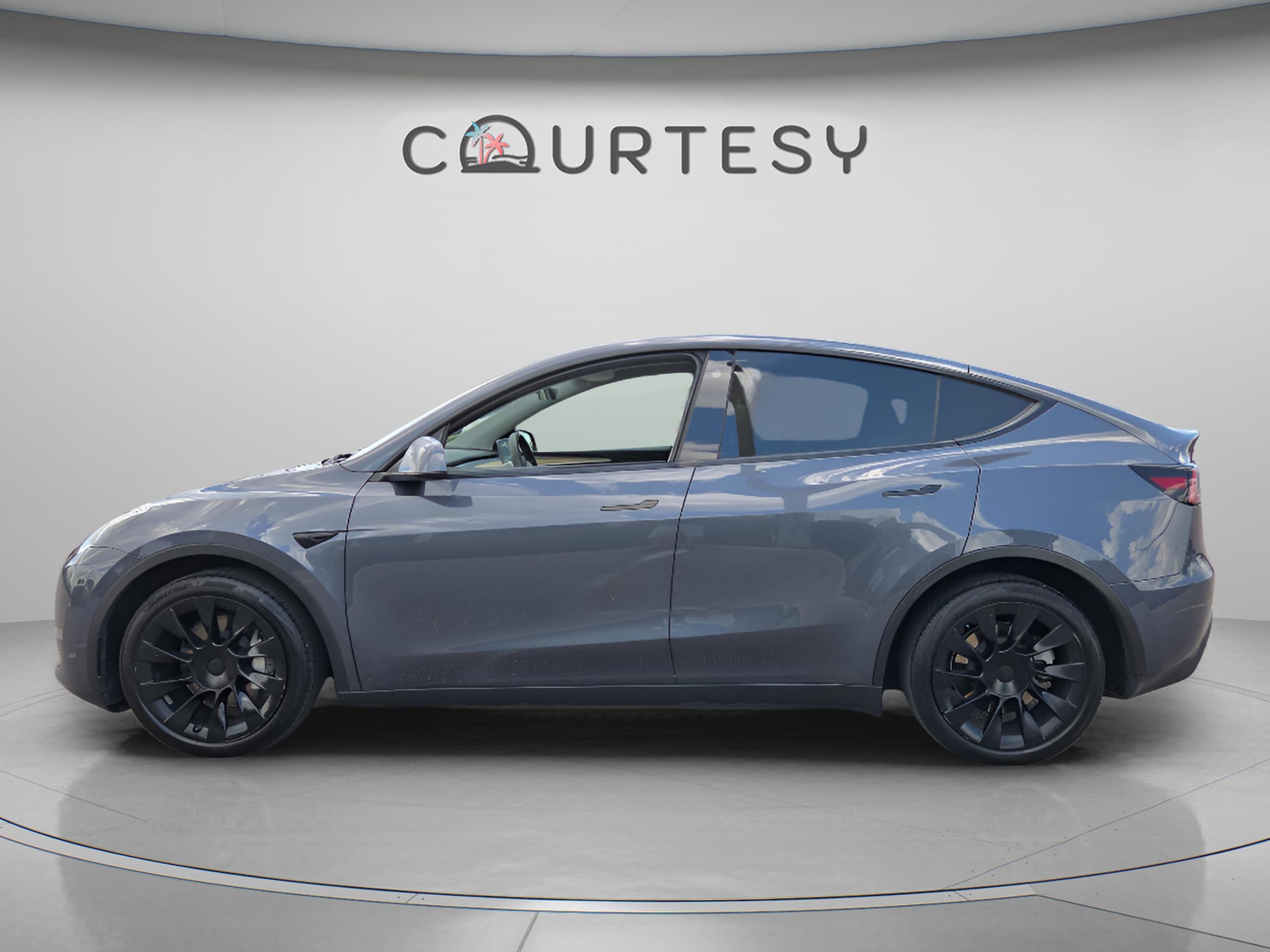 Used 2023 Tesla Model Y Long Range with VIN 7SAYGDEE3PA050204 for sale in Tampa, FL