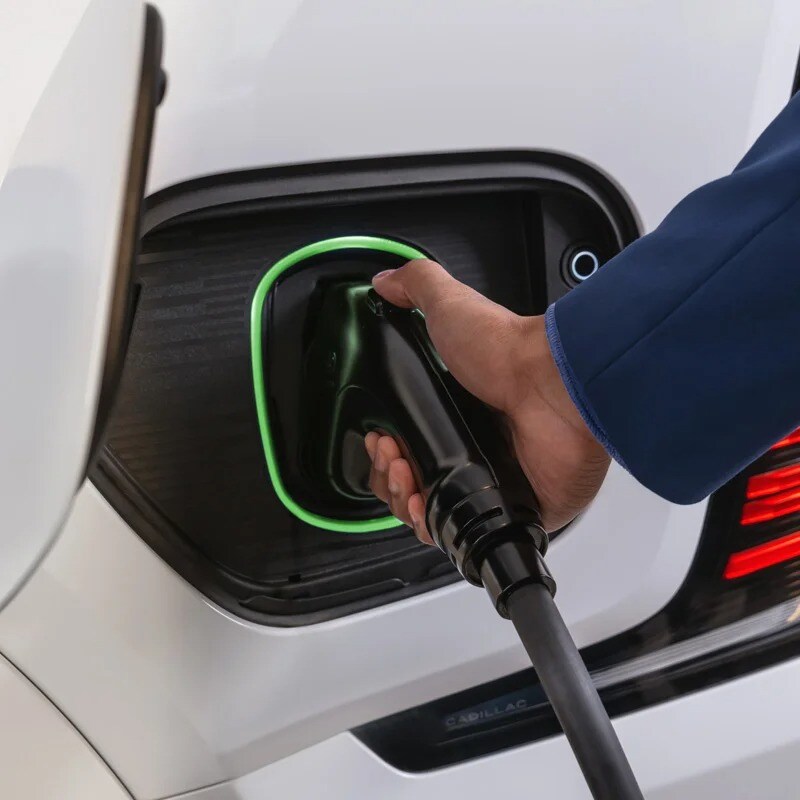  Person cheerfully signing documents.