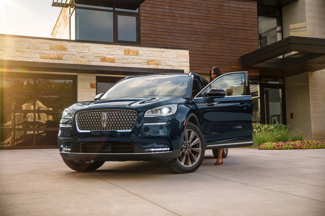  Person cheerfully signing documents.