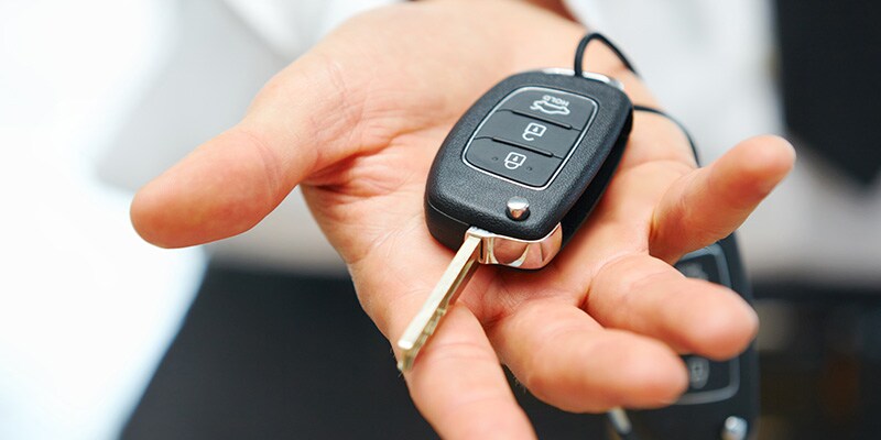 Happy couple holding car keys