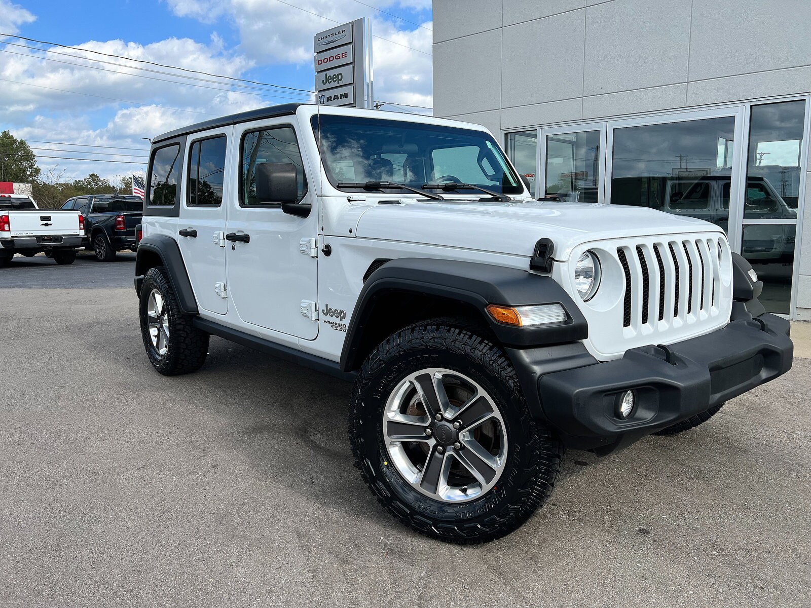 Used 2021 Jeep Wrangler Unlimited Sport with VIN 1C4HJXDN1MW613018 for sale in Hillsdale, MI