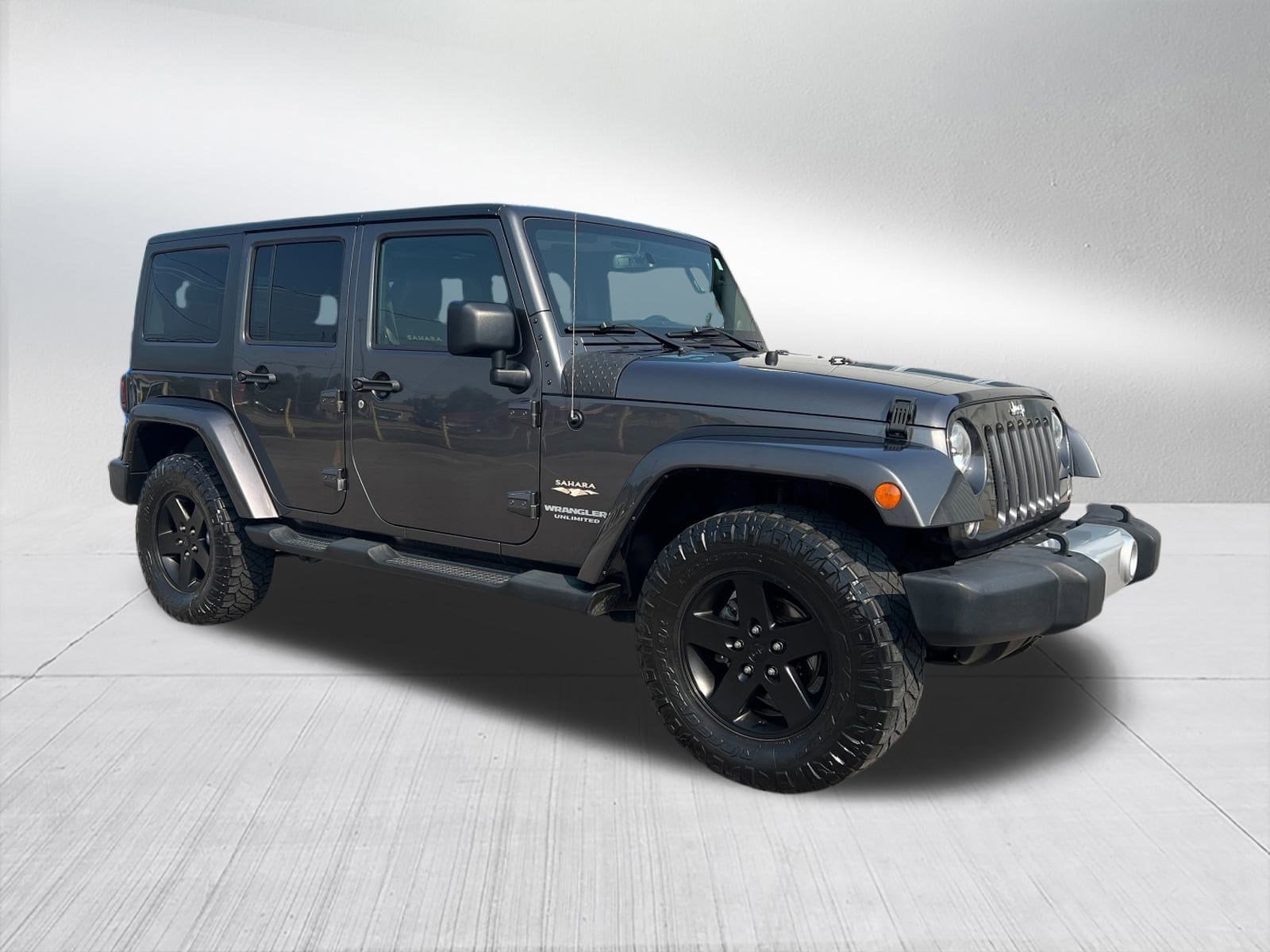 Used 2014 Jeep Wrangler Unlimited Sahara with VIN 1C4BJWEG4EL203929 for sale in Hillsdale, MI
