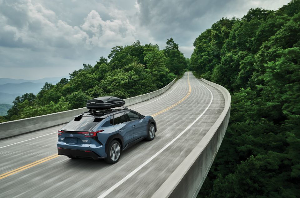 2025 Subaru Solterra EV driving on bridge