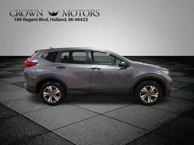 Used 2019 Honda CR-V LX with VIN 5J6RW6H3XKL006066 for sale in Holland, MI