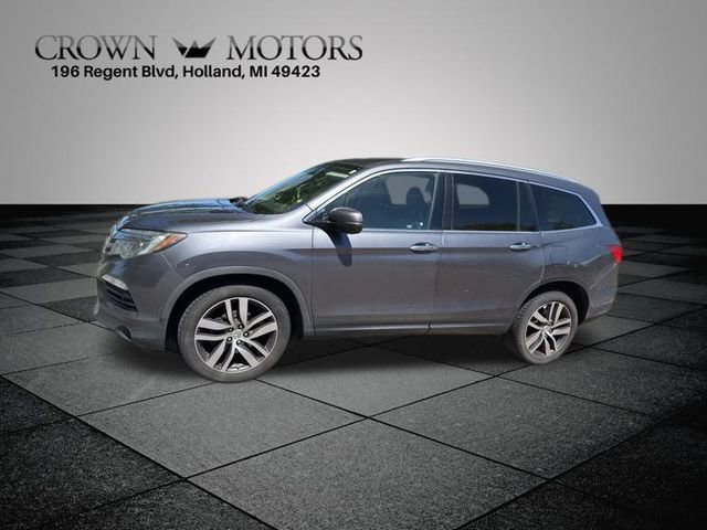 Used 2017 Honda Pilot Touring with VIN 5FNYF6H91HB012758 for sale in Holland, MI