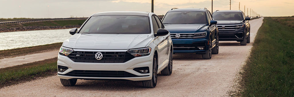 Volkswagens lined up on the road