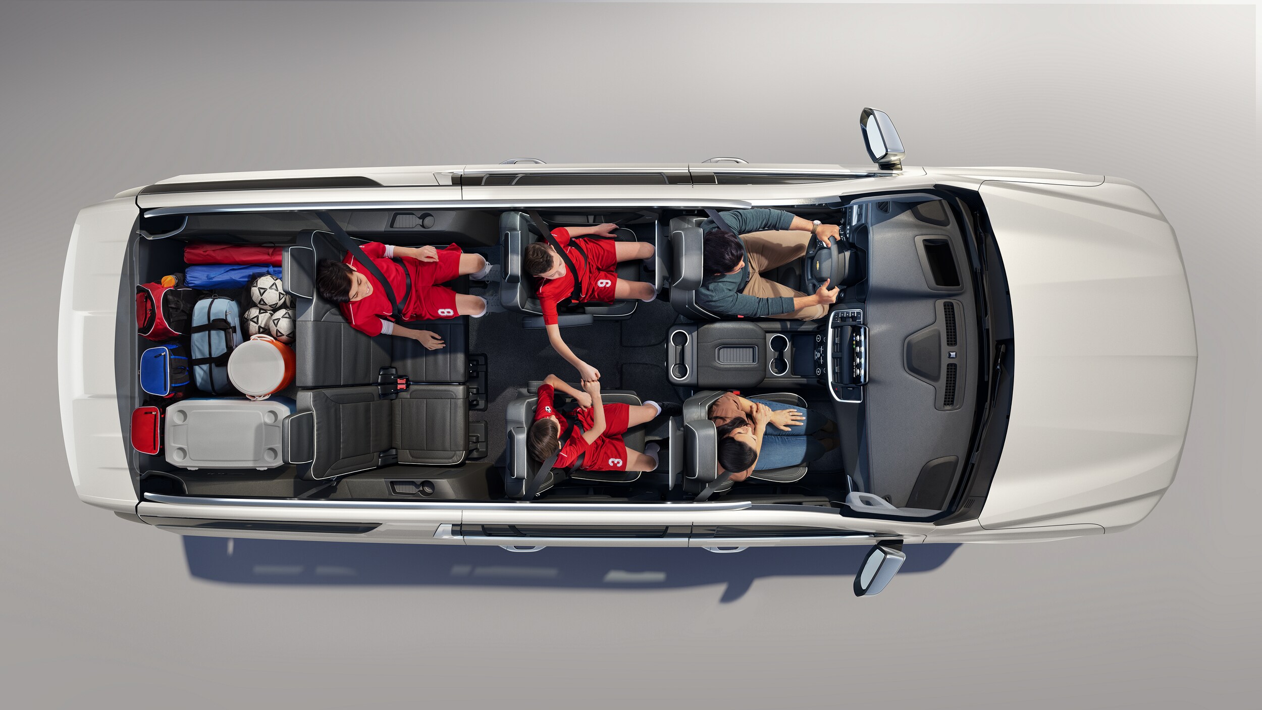 Top view of three row Chevy SUV with family inside