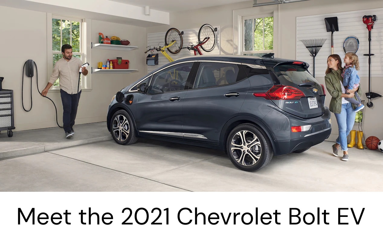 Chevrolet Bolt EV in garage with family
